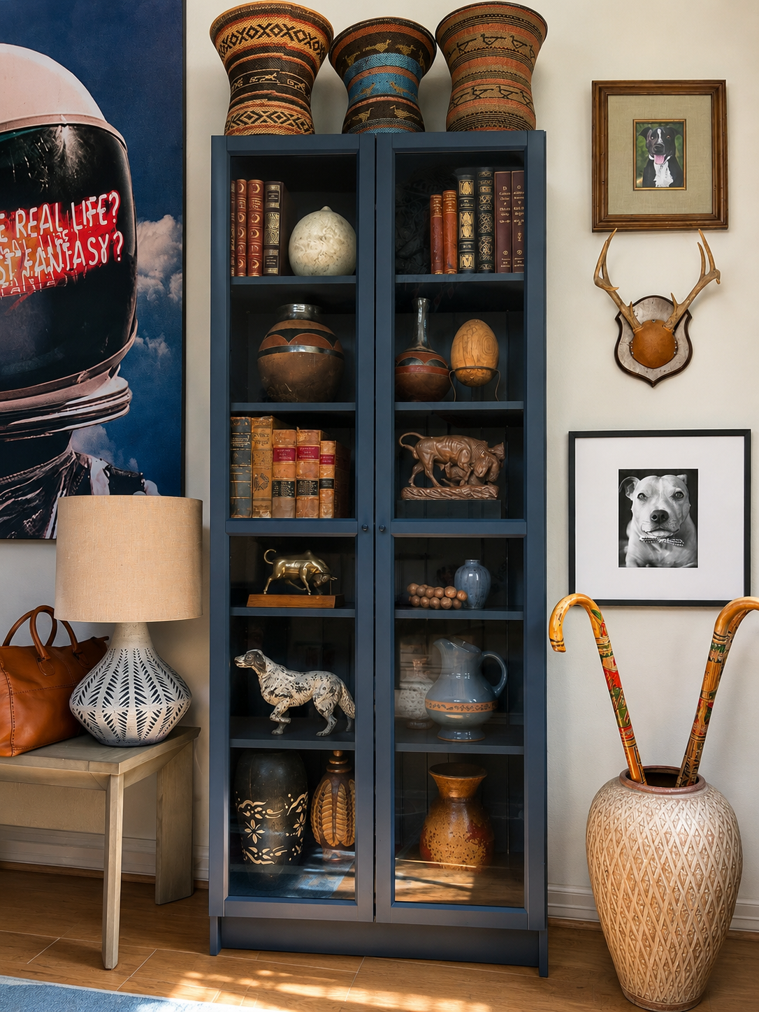 Sophisticated entryway bookshelf and art display by This Is Home Studio in Houston, Texas designed by Founders Luke and Alejandra Fortin. Home located in Houston's Museum District.